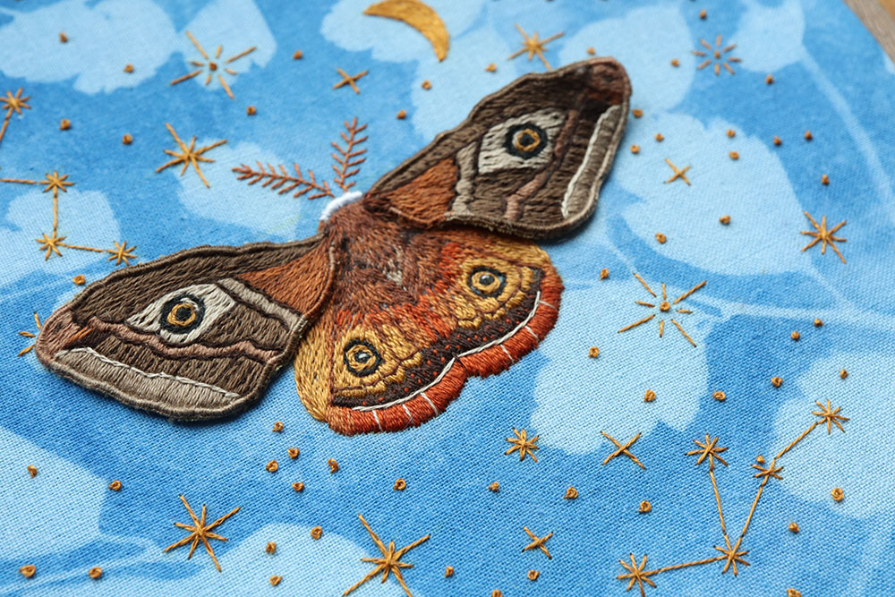 magical moth friend on sun printed fabric